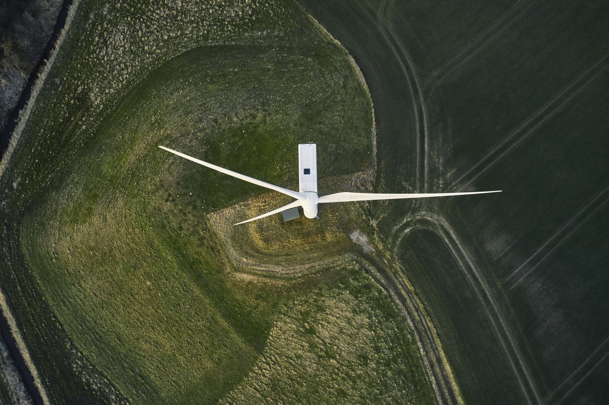 Overhead view of a wind turbine on top of a hill