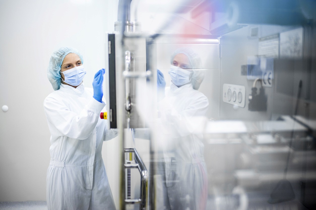 A worker examines a nuclear material storage facility
