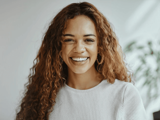 Smiling woman with white blouse