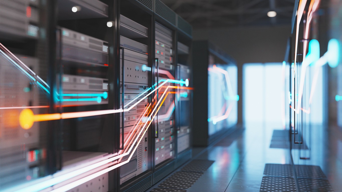 Neon lines flow across glass in a data storage facility
