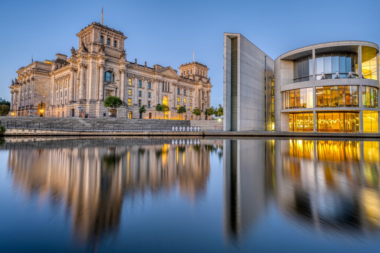 The Reichstag building in Germany in front of a body of water